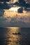 Silhouette two women kayaking boat on sea at sunset