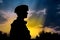 Silhouette of a Ukrainian soldier on the background of the flag of Ukraine, Generative AI 1