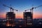 Silhouette of unfinished towers against a serene sunset, stalled construction amidst urban progress