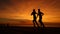 SILHOUETTE: Unknown athletic couple running along calm ocean at orange sunset.