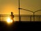 Silhouette of unknown city people walking across the overpass Flyover