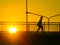 Silhouette of unknown city people walking across the overpass Flyover