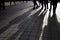 Silhouette of unrecognized people walking in the street.