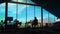 The silhouette of a videographer at a workplace in his office.