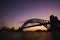 Silhouette view of Sydney Harbour Bridge on colourful twilight s