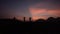 Silhouette of  village children dancing during sunset in the mountains