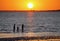 Silhouette of visitors in the shallow water during sunset at Rocky Point Beach, Tampa, Florida, U.S.A