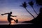 Silhouette Volley Kick football on the beach, Asian man play soccer at sunrise