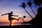 Silhouette Volley Kick football on the beach, Asian man play soccer at sunrise