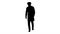 Silhouette Walking young male doctor in a mask and a medical cap.