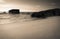Silhouette of war blockhouse on scenic beautiful sandy beach seascape with waves on atlantic coast i