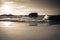 Silhouette of war blockhouse on scenic beautiful sandy beach seascape with waves on atlantic coast i