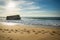 Silhouette of war blockhouse on scenic beautiful sandy beach seascape with waves on atlantic ocean