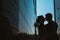 Silhouette Wedding couple on background mirror buildings