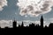Silhouette of Westminster: the house of parliament and the Big Ben over a cloudy sky in London