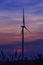 Silhouette wind turbine farm over moutain cloud in blue twilight