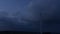Silhouette wind turbine farm over moutain with twilight sky and white clouds. Timelaps with rotating wind power plants