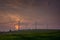 Silhouette of wind turbine generating electricity on sunset