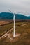 Silhouette of a wind turbine on a mountain at sunset, a windmill in the Ukrainian Carpathians, a windmill close up, top view