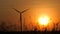 Silhouette of wind turbine over sunset ecology energy concept for electric maker the technology of alternate clean power form wind