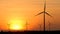 Silhouette of wind turbine over sunset ecology energy concept for electric maker the technology of alternate clean power form wind