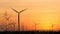 Silhouette of wind turbine over sunset ecology energy concept for electric maker the technology of alternate clean power form wind