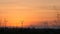 Silhouette of wind turbine over sunset ecology energy concept for electric maker the technology of alternate clean power form wind