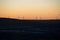 A silhouette of a windfarm at sunset in Kimberworth, Rotherham