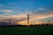 Silhouette of windmill electric power turbine