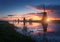 Silhouette of windmills at sunrise in Kinderdijk, Netherlands