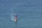 Silhouette of a windsurfer on the waves of the Mediterranean sea