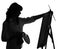 Silhouette of woman artist painting