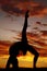 Silhouette woman backbend leg up