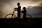 Silhouette of woman and child cycling