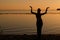 Silhouette of woman dancing tradition trible oriental near big river coast