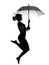 Silhouette woman flying holding open umbrella