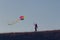 Silhouette Of woman flying kite