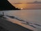 silhouette of a woman on grande anse beach in sunset, deshaies, guadeloupe