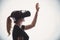 Silhouette of a woman in a helmet of virtual reality