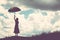 Silhouette of woman holding umbrella sunny day