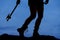 Silhouette woman legs hatchet behind