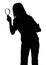 Silhouette of woman with magnifying glass