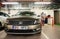 Silhouette of woman paying at tte Caisse Automatique Parking