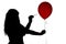 Silhouette of woman pierced with a needle balloon