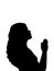 Silhouette of woman praying close up