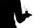 Silhouette of a woman`s hand with an incandescent glowing lamp in hand, thought bulb, concept of idea