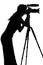 Silhouette of a woman shoots video