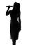 Silhouette of a woman singing with a microphone in hands