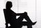 Silhouette of woman sitting in the office (blind)