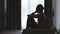 Silhouette of Woman suffering from depression lies on the sofa , has stress, anxiety, sickness and headaches, life problems,